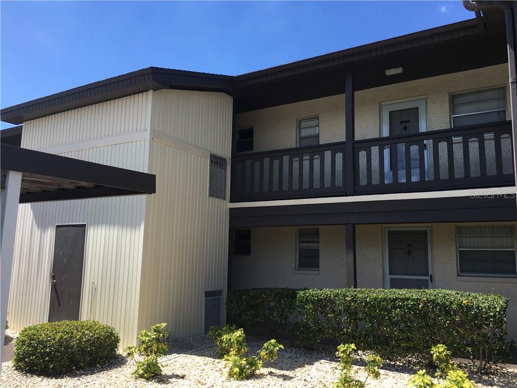 5207 Turquoise Lane, Unit 203 New Port Richey, FL 34652 - Photo 1 of 1 a front view of a house