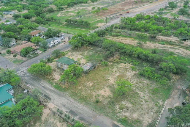 a view of a street with a yard