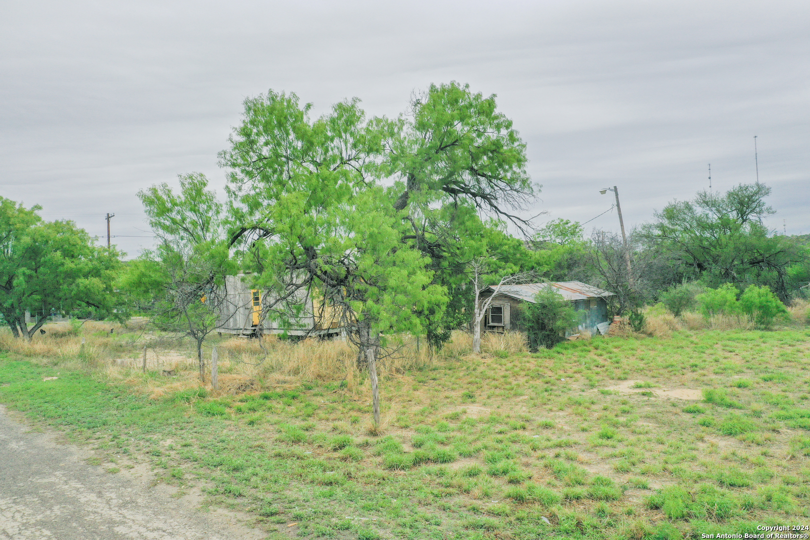 3000 West Broadbent Del Rio, TX 78840 - Photo 10 of 13 a backyard of a house with lots of green space and fountain