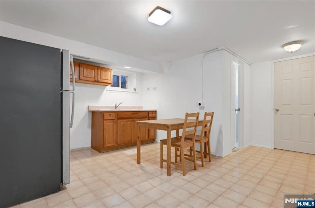 497 Oakdene Avenue Ridgefield, NJ 07657 - Photo 16 of 28 a dining room with a table and chairs