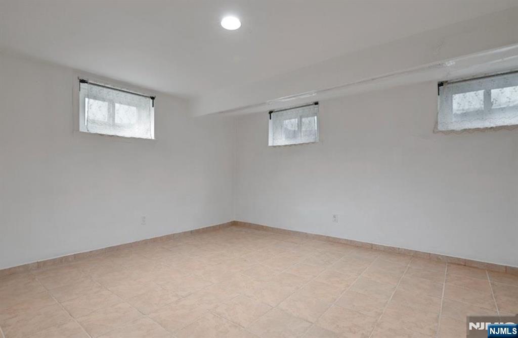 497 Oakdene Avenue Ridgefield, NJ 07657 - Photo 17 of 28 a view of an empty room with a window