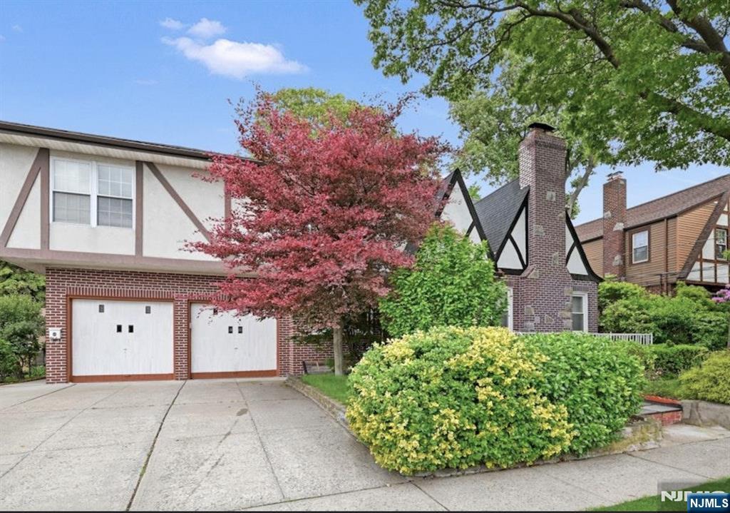 497 Oakdene Avenue Ridgefield, NJ 07657 - Photo 2 of 28 front view of a house with a tree