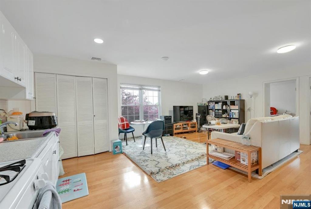 497 Oakdene Avenue Ridgefield, NJ 07657 - Photo 21 of 28 a living room with furniture and a flat screen tv