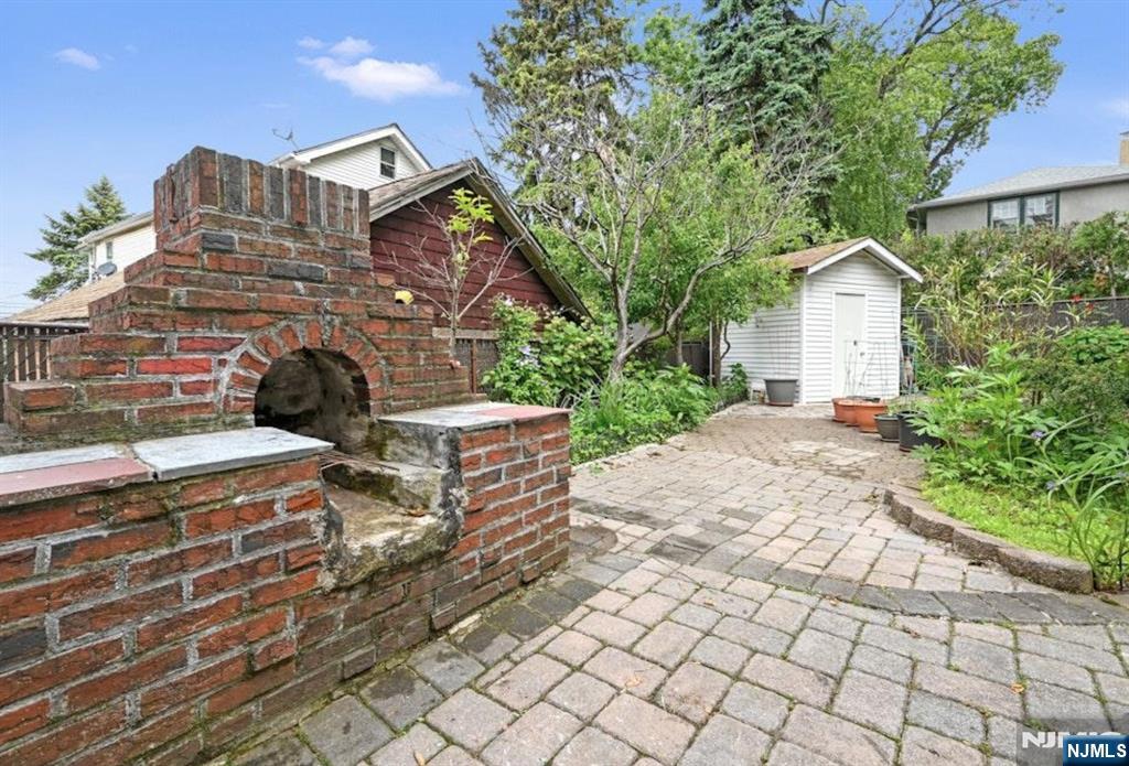 497 Oakdene Avenue Ridgefield, NJ 07657 - Photo 26 of 28 a front view of a house with a yard