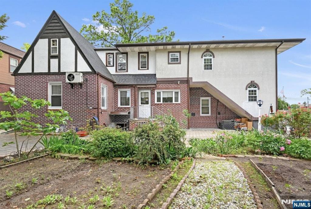 497 Oakdene Avenue Ridgefield, NJ 07657 - Photo 5 of 28 a front view of a house with a garden