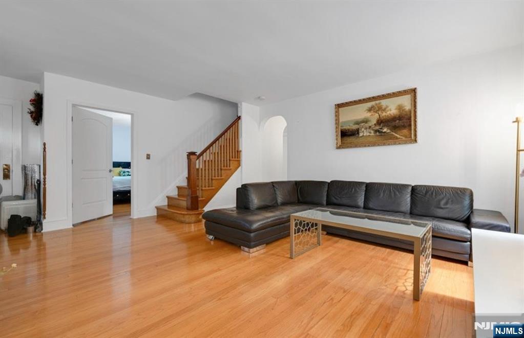 497 Oakdene Avenue Ridgefield, NJ 07657 - Photo 7 of 28 a living room with furniture and a wooden floor