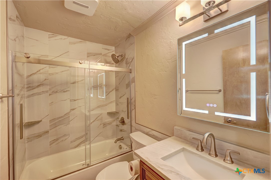 210 Center Point Drive Center Point, TX 78010 - Photo 25 of 44 Bathroom 2 with heat/lighted mirror Marble Tile