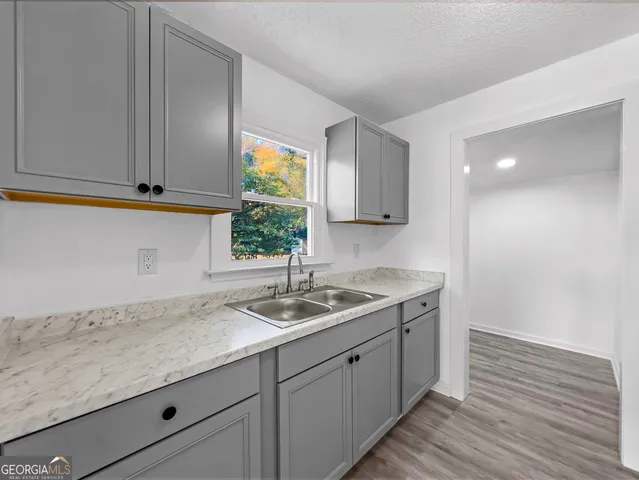 a kitchen with a refrigerator and countertop