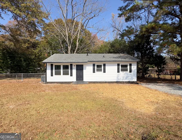 a house with trees in the background
