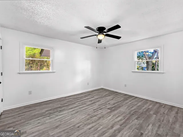 a house with trees in the background