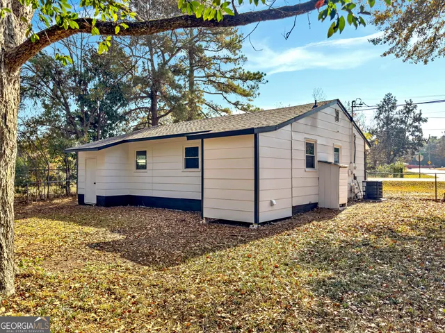 a view of a yard with large trees