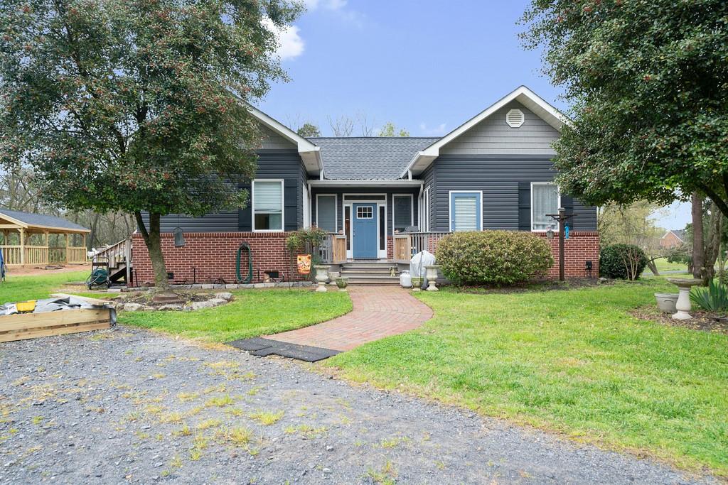 1230 McEntyre Loop Calhoun, GA 30701 - Photo 1 of 1 a front view of house with yard and green space