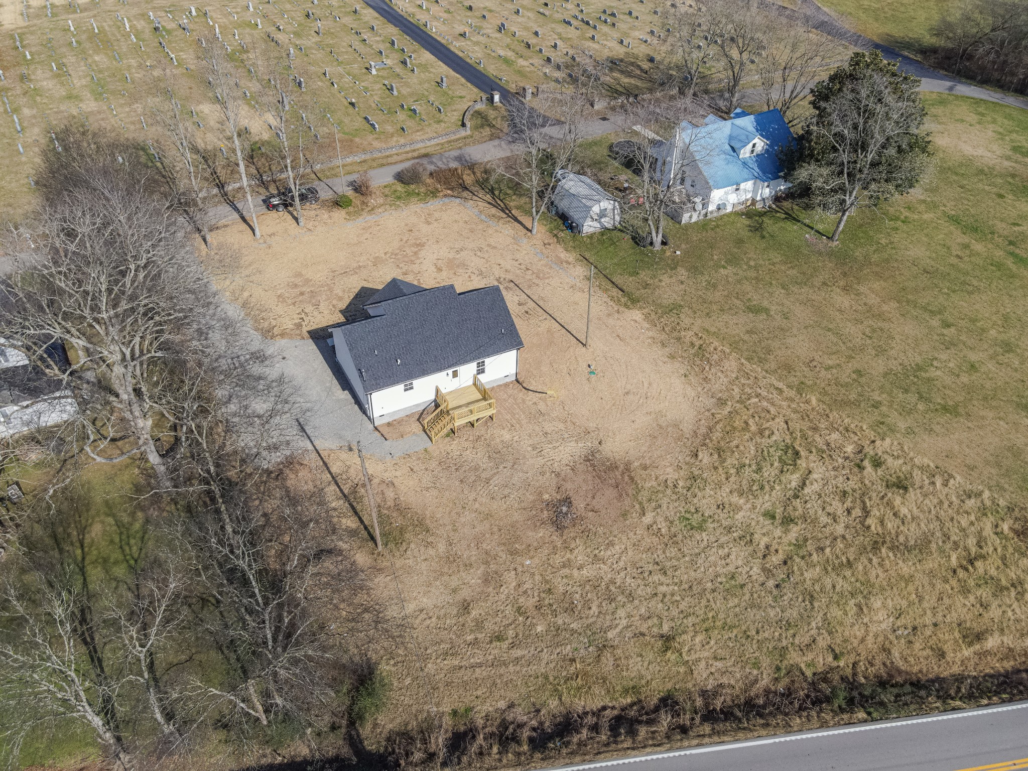 7 Orchard Cemetery Road Petersburg, TN 37144 - Photo 19 of 53 a view of a dry yard with wooden fence