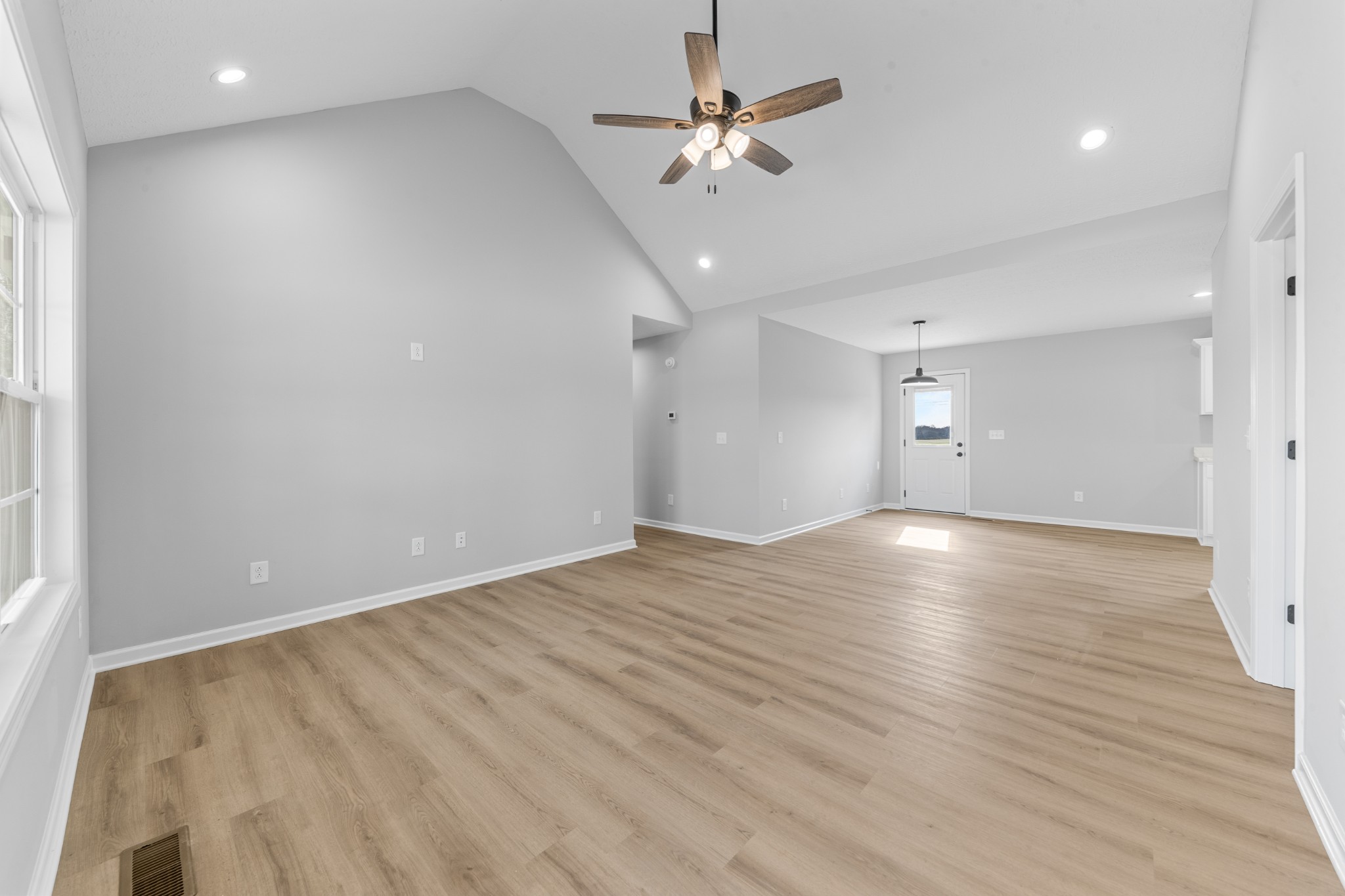 7 Orchard Cemetery Road Petersburg, TN 37144 - Photo 22 of 53 an empty room with wooden floor and ceiling fan