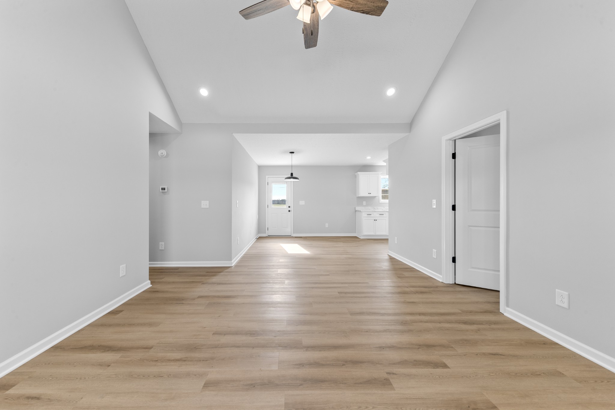 7 Orchard Cemetery Road Petersburg, TN 37144 - Photo 23 of 53 a view of an empty room with chandelier fan and wooden floor