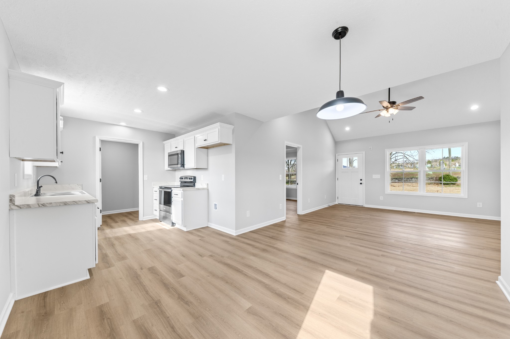 7 Orchard Cemetery Road Petersburg, TN 37144 - Photo 33 of 53 a view of a kitchen with kitchen island a sink wooden floor and a refrigerator