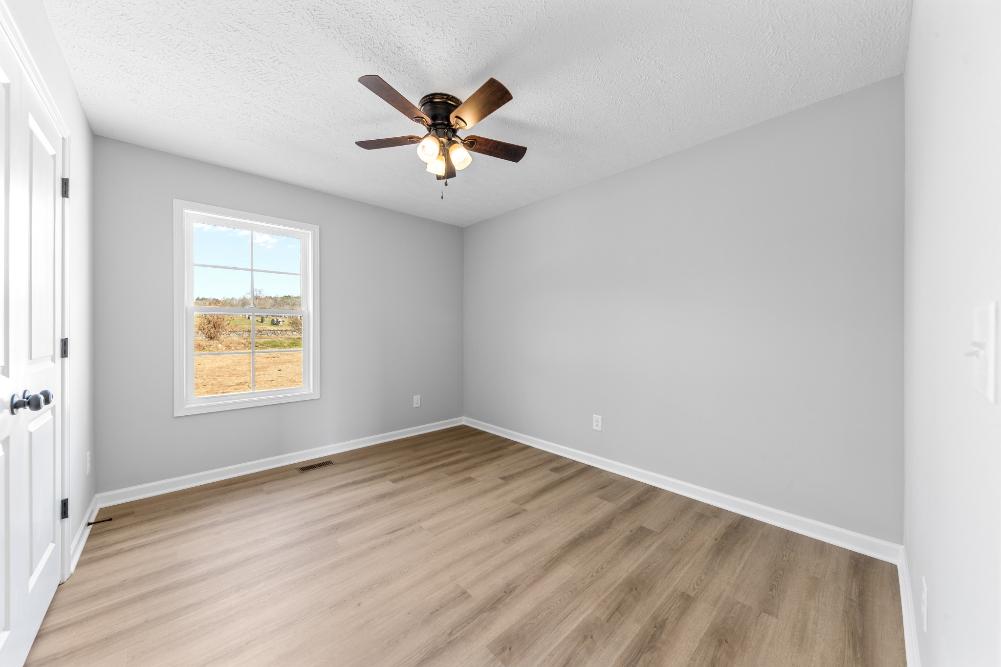 7 Orchard Cemetery Road Petersburg, TN 37144 - Photo 47 of 53 a view of empty room with wooden floor and fan