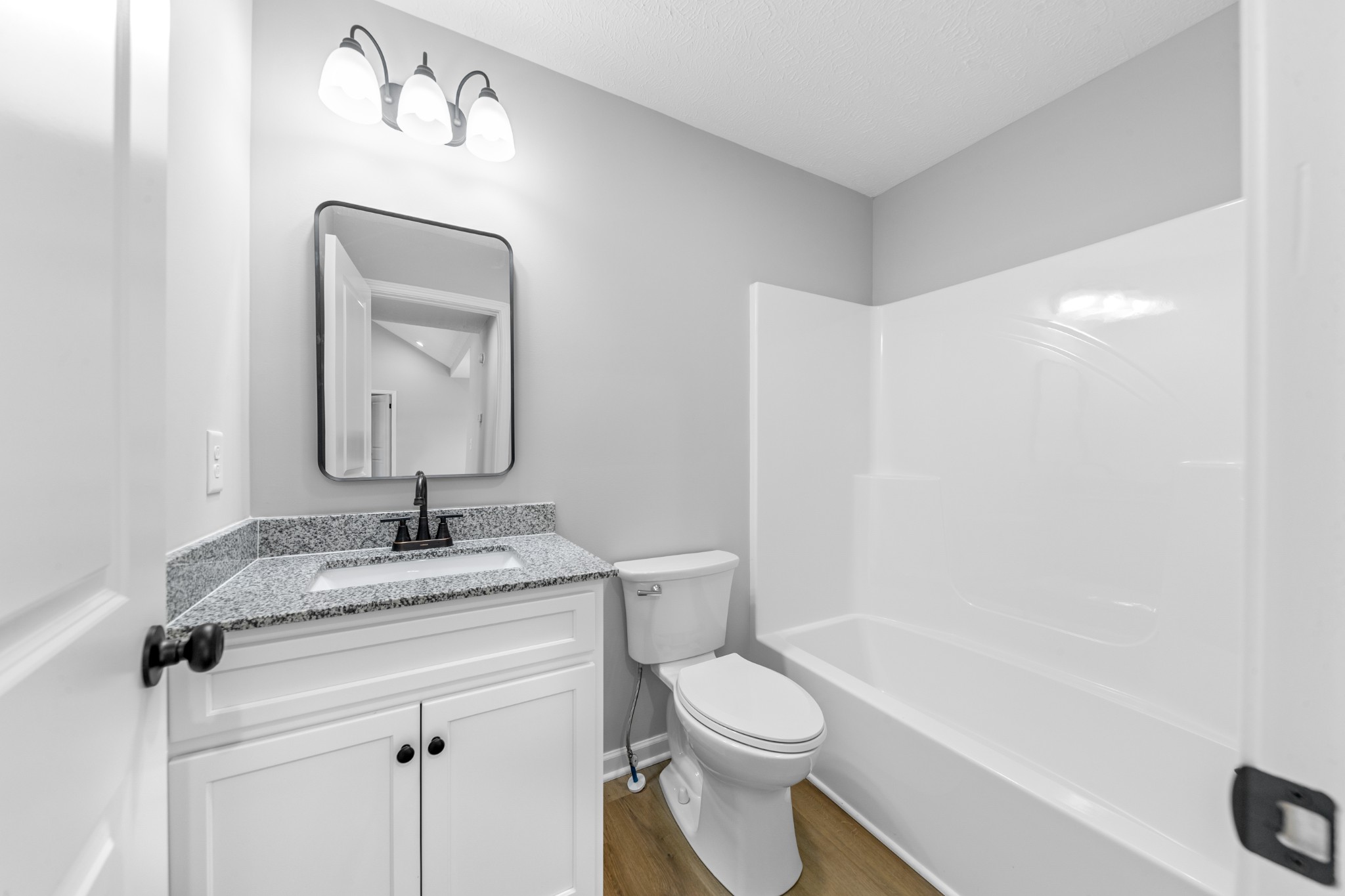 7 Orchard Cemetery Road Petersburg, TN 37144 - Photo 49 of 53 a bathroom with a granite countertop sink a toilet and a bathtub