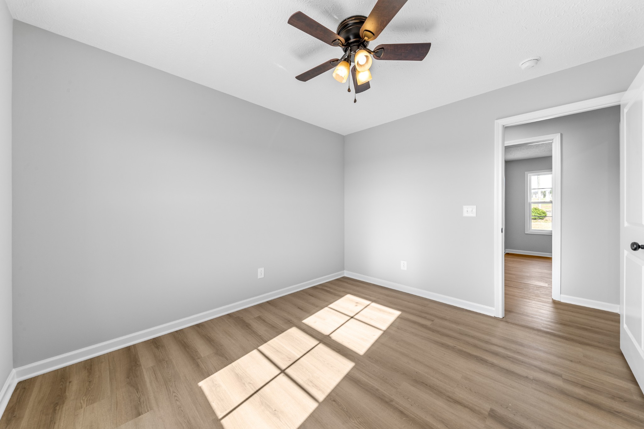 7 Orchard Cemetery Road Petersburg, TN 37144 - Photo 51 of 53 an empty room with wooden floor and windows
