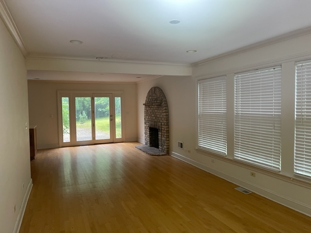 205 Oakdene Drive Barrington, IL 60010 - Photo 2 of 10 a view of an empty room with a window and wooden floor