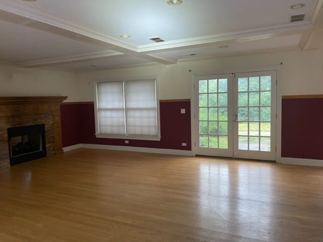 205 Oakdene Drive Barrington, IL 60010 - Photo 6 of 10 a view of an empty room with glass door and wooden floor