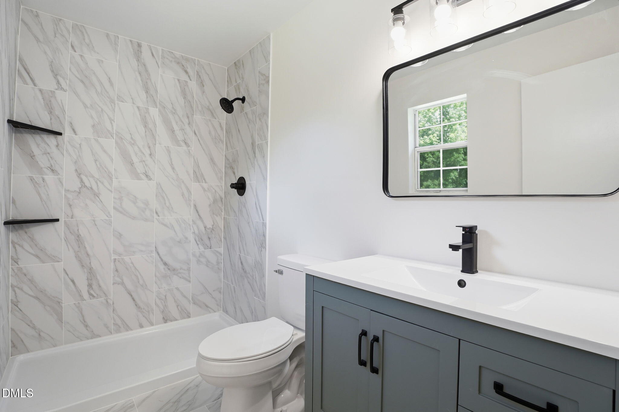 3602 Harrison Road Castalia, NC 27816 - Photo 42 of 48 a bathroom with a sink toilet a mirror and shower