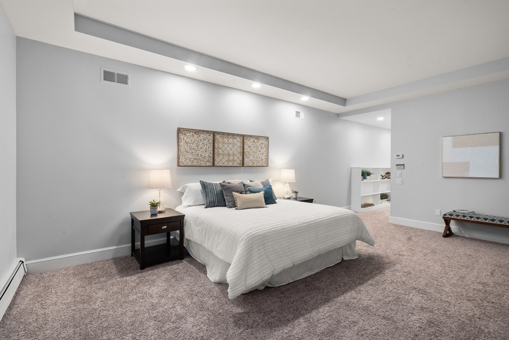 214 Allandale Road, Unit B Boston, MA 02467 - Photo 16 of 35 a bedroom with a bed and a lamp