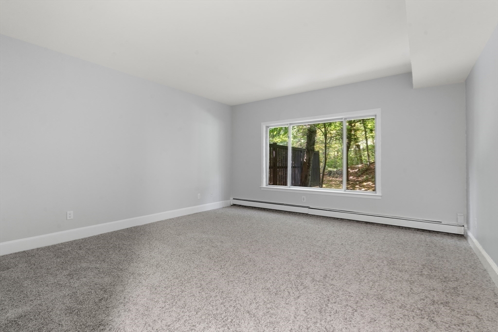 214 Allandale Road, Unit B Boston, MA 02467 - Photo 22 of 35 an empty room with a window