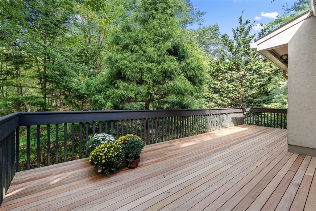 214 Allandale Road, Unit B Boston, MA 02467 - Photo 24 of 35 a balcony with wooden floor