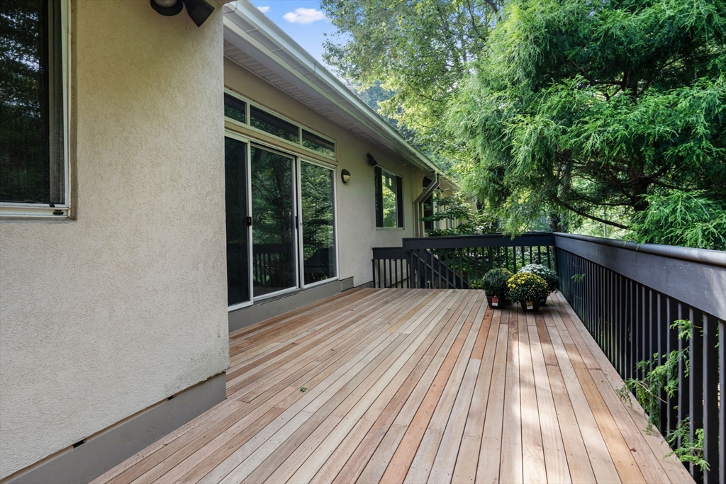 214 Allandale Road, Unit B Boston, MA 02467 - Photo 25 of 35 a view of backyard with a deck and wooden floor