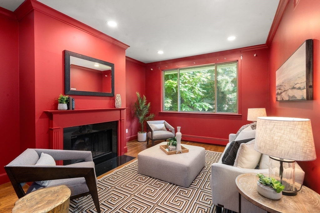 214 Allandale Road, Unit B Boston, MA 02467 - Photo 5 of 35 a living room with furniture and a fireplace