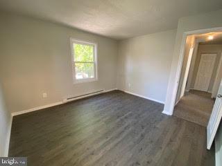 65 Berkshire Road Sicklerville, NJ 08081 - Photo 22 of 29 an empty room with wooden floor and windows