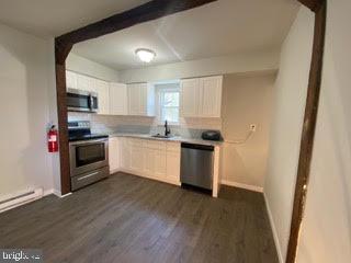 65 Berkshire Road Sicklerville, NJ 08081 - Photo 4 of 29 a kitchen with a white cabinets and white appliances