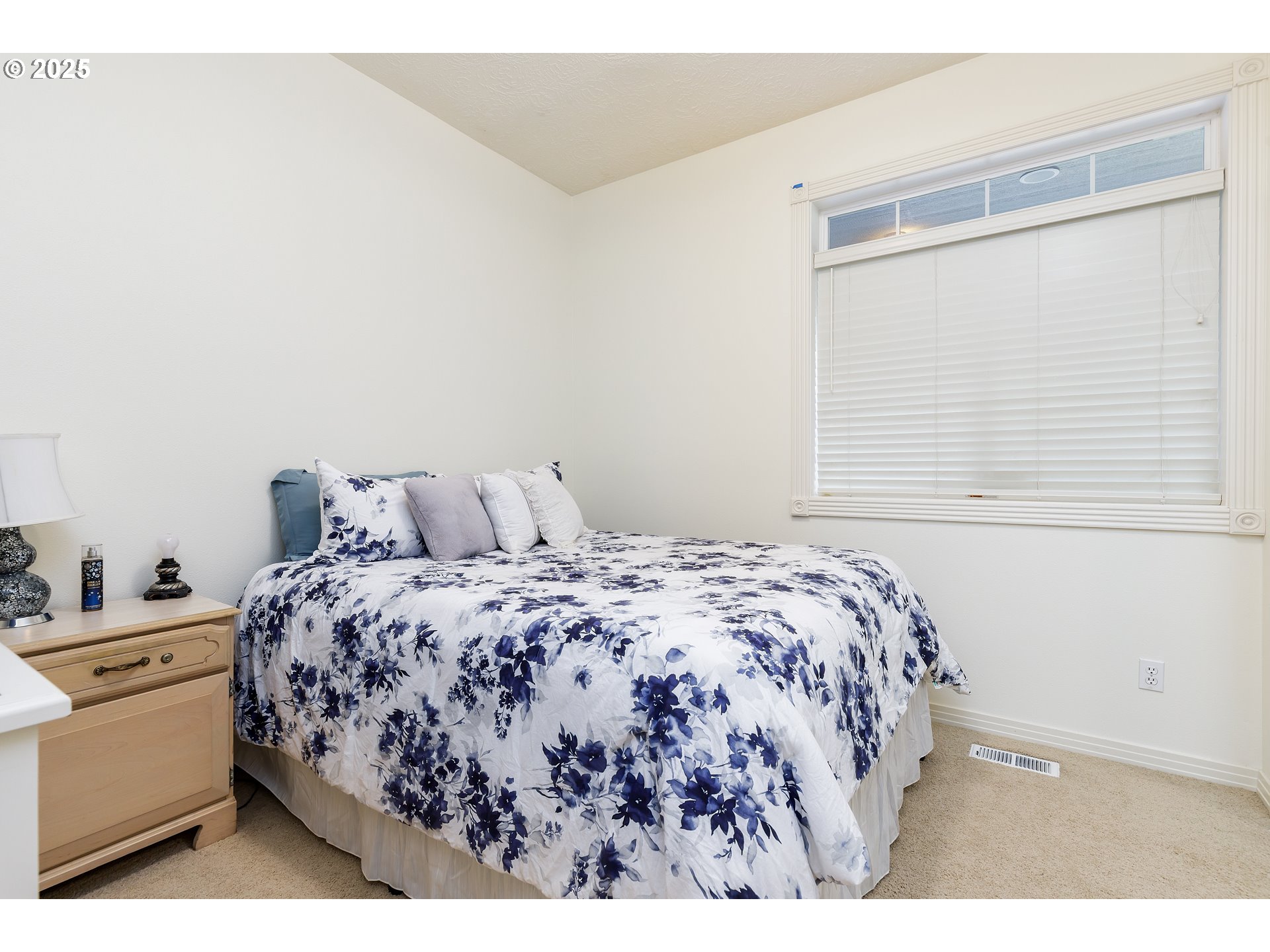 2573 Southeast Morlan Way Gresham, OR 97080 - Photo 24 of 47 a bedroom with a bed and a window