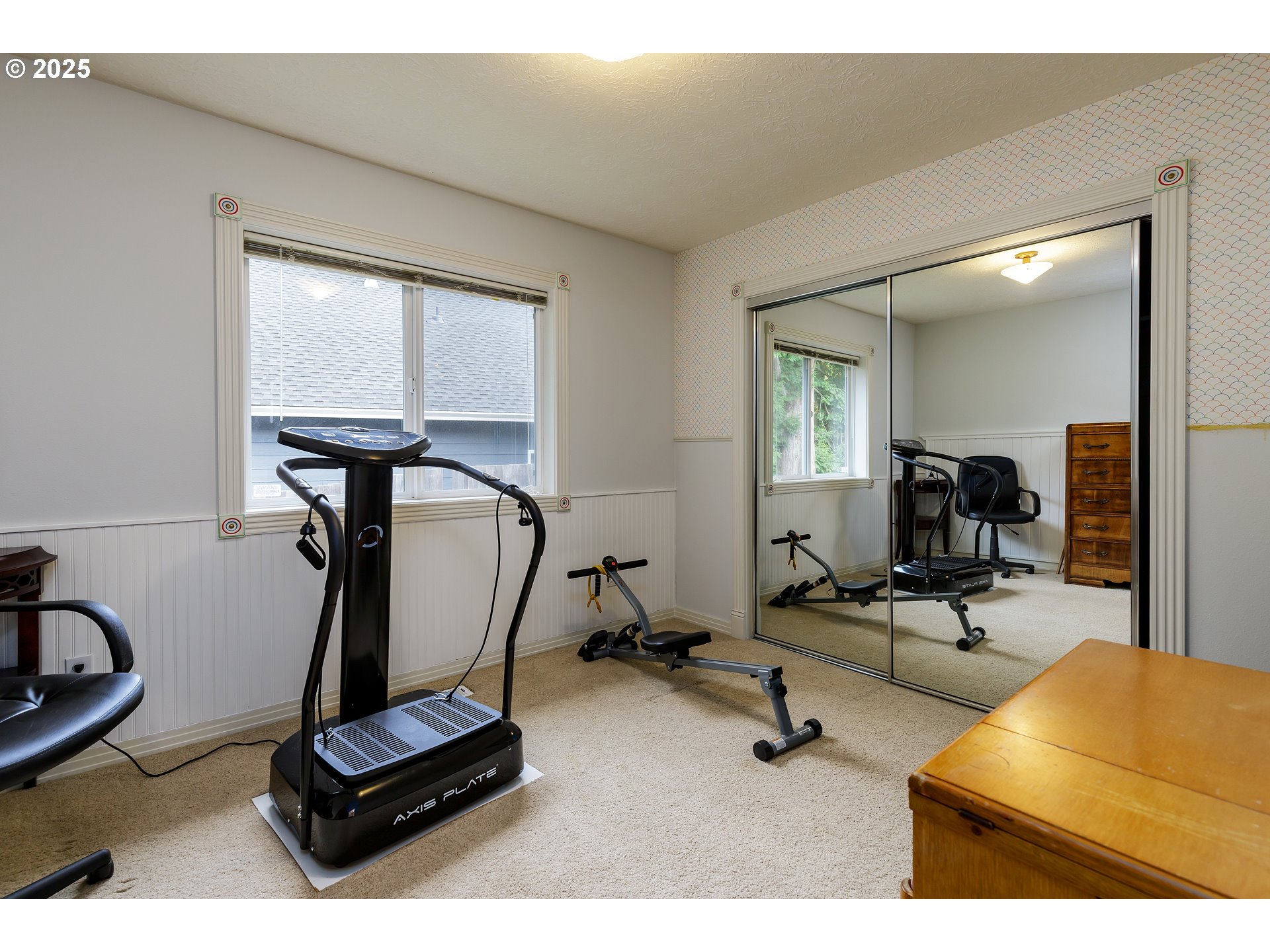 2573 Southeast Morlan Way Gresham, OR 97080 - Photo 26 of 47 a room with gym equipment and windows
