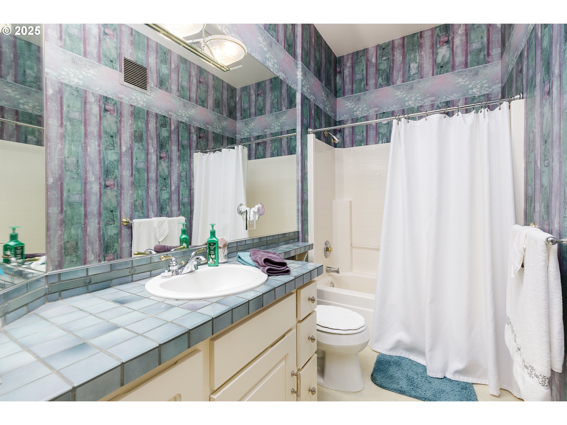 2573 Southeast Morlan Way Gresham, OR 97080 - Photo 27 of 47 a bathroom with a granite countertop sink a toilet and shower