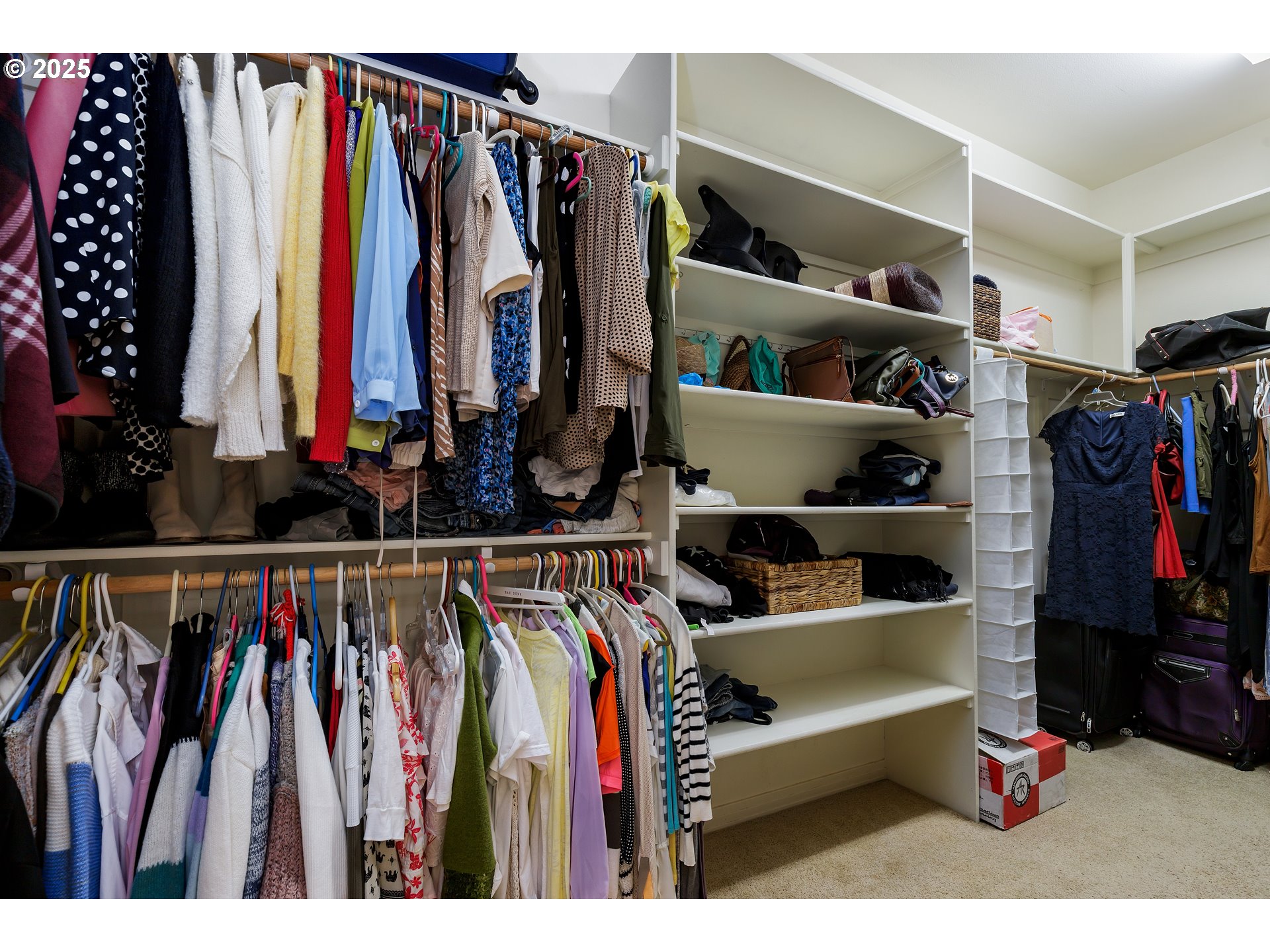 2573 Southeast Morlan Way Gresham, OR 97080 - Photo 34 of 47 a view of walk in closet with clothes and shoes