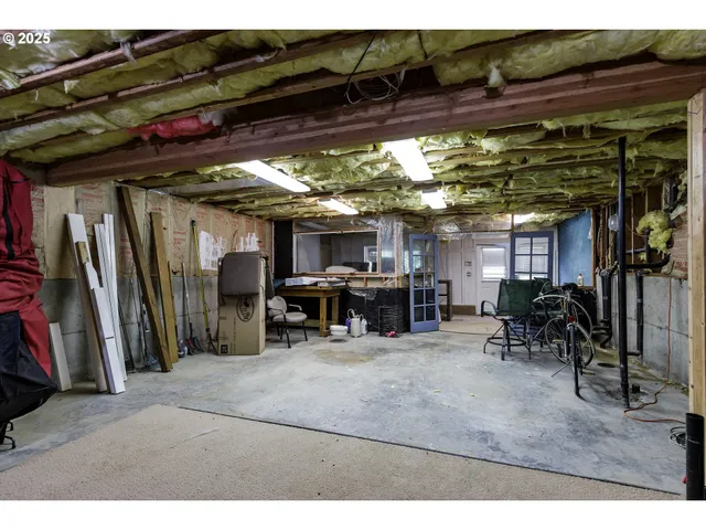 a backyard of a house with barbeque oven