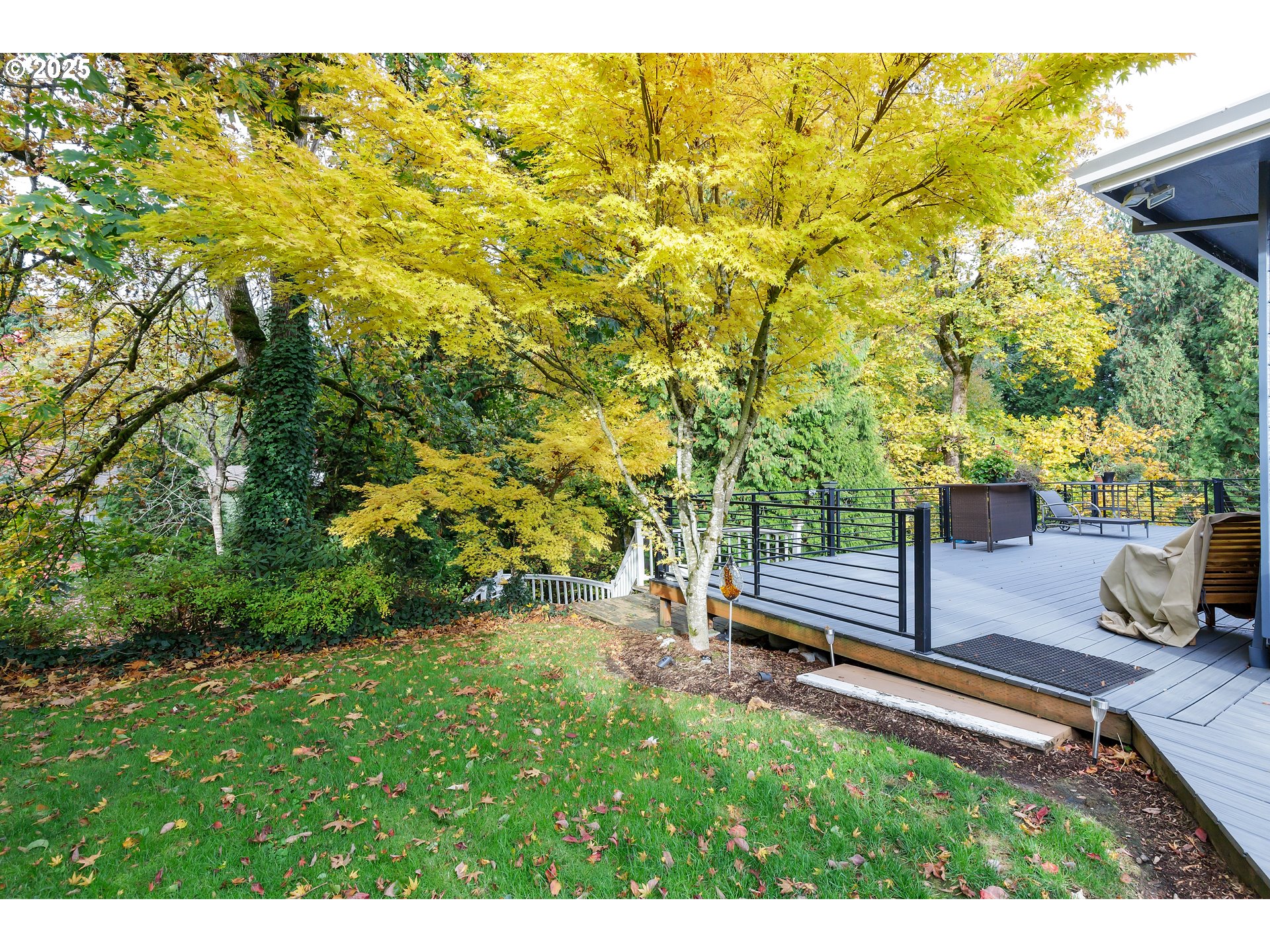 2573 Southeast Morlan Way Gresham, OR 97080 - Photo 39 of 47 a backyard of a house with table and chairs