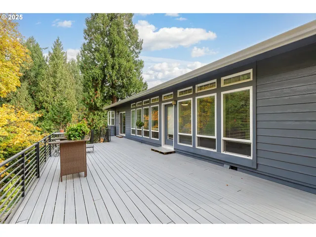 a view of a terrace with wooden floor and fence