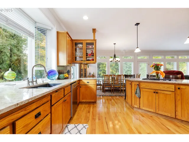 a very nice looking kitchen with a large window