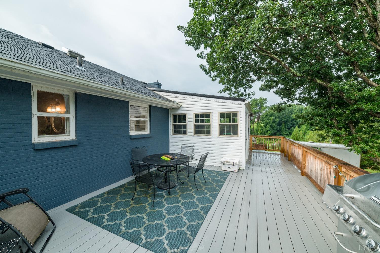 1129 Rugby Road Lynchburg, VA 24503 - Photo 23 of 56 Homeowner installed this oversized Trex deck that provides plenty of room for those lovely outdoor summer dinners & time relaxing outside on those cool fall days!