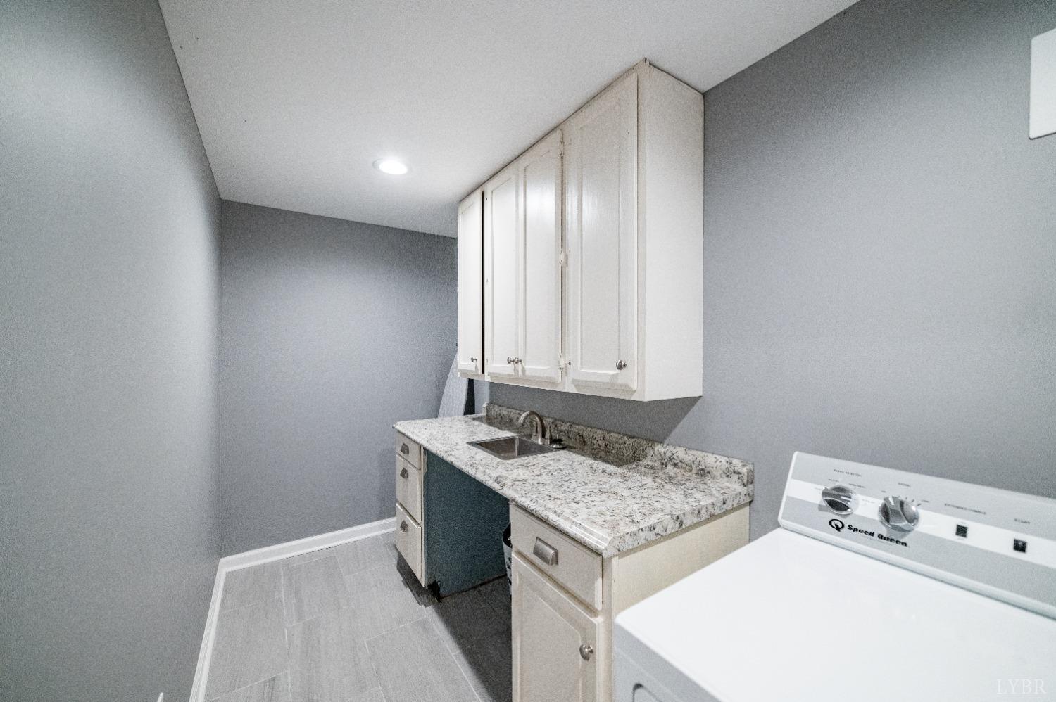 1129 Rugby Road Lynchburg, VA 24503 - Photo 39 of 56 Large laundry with utility sink and plenty of storage