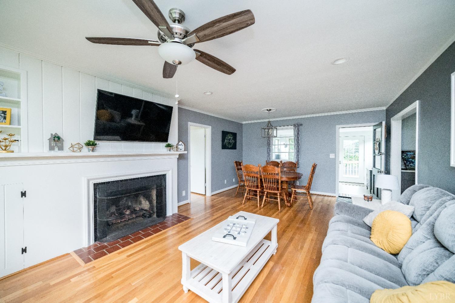 Large family room with open concept dining room that flows into kitchen