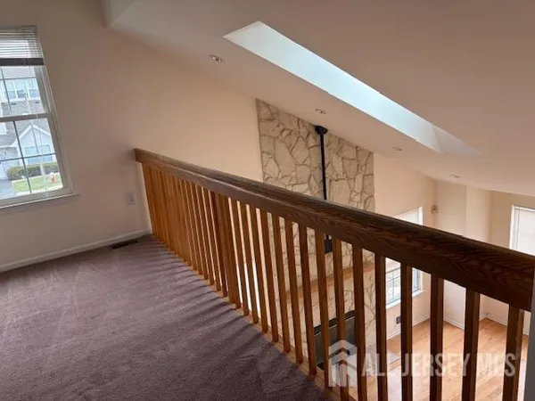 a view of a hallway with stairs