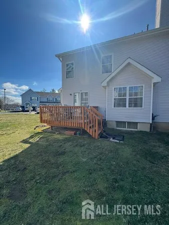 a view of a house with a yard and a garden