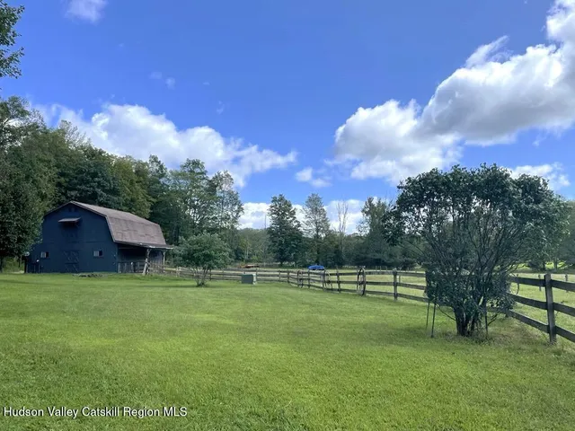 an empty room with wooden floor and closet