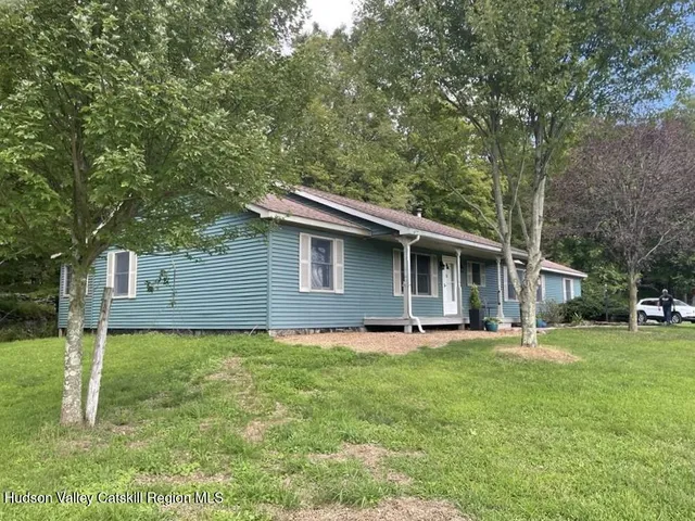 a backyard of a house with lots of green space
