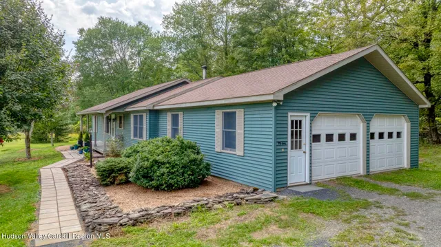 a backyard of a house with lots of green space