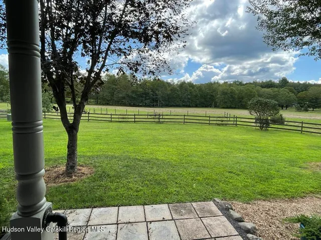 a kitchen with stainless steel appliances granite countertop a stove a sink dishwasher and a microwave